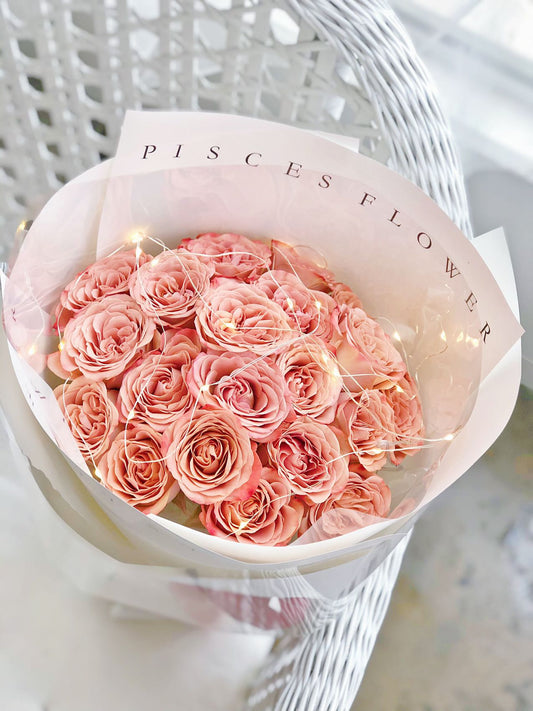 Cappuccino Rose Only Bouquet with pink roses and fairy lights in white Pisces Flower paper wrap — Same Day Delivery Melbourne | Pisces Flower