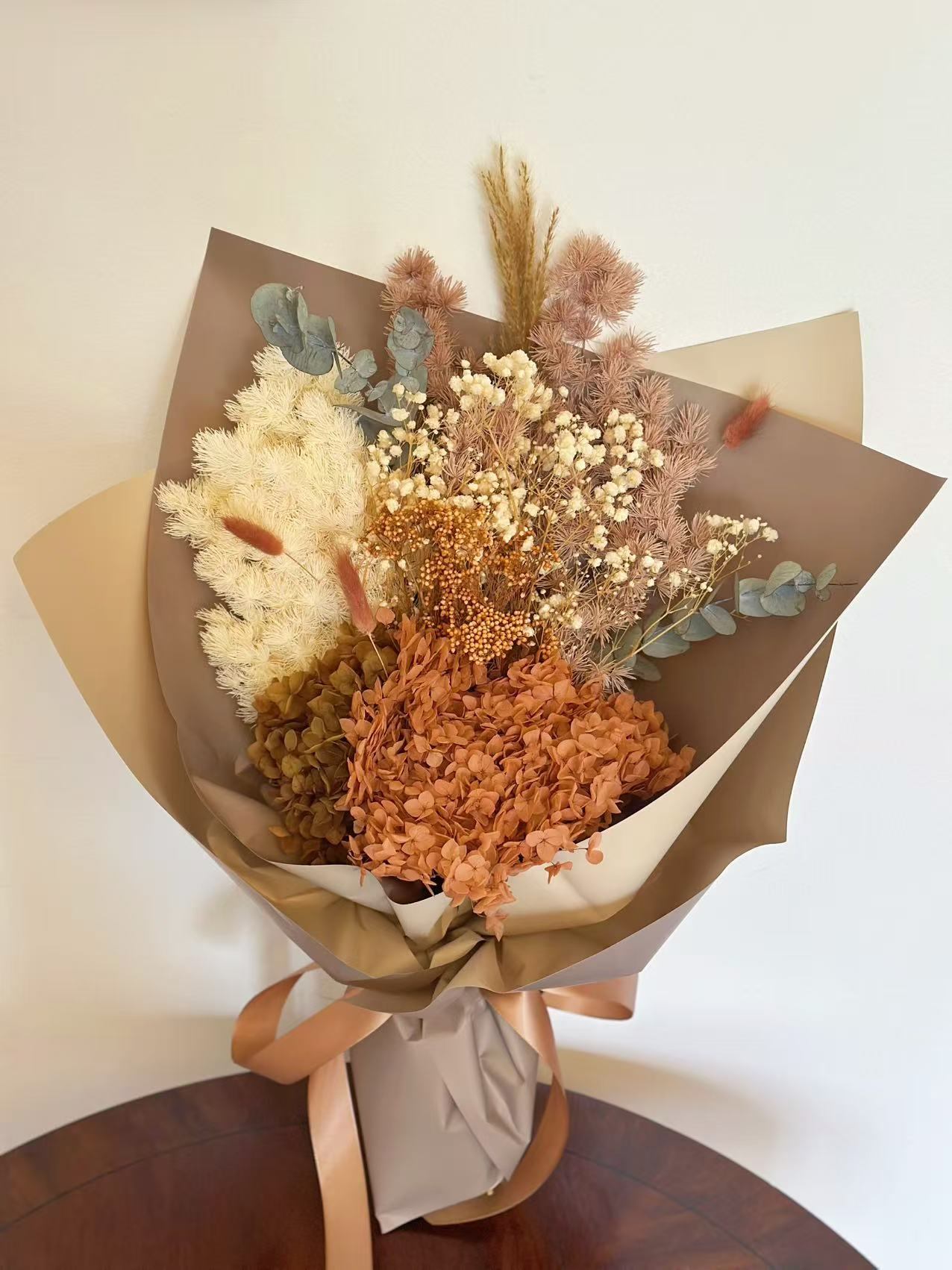Native dry flower bouquet with preserved hydrangea, eucalyptus, baby's breath and dried grasses